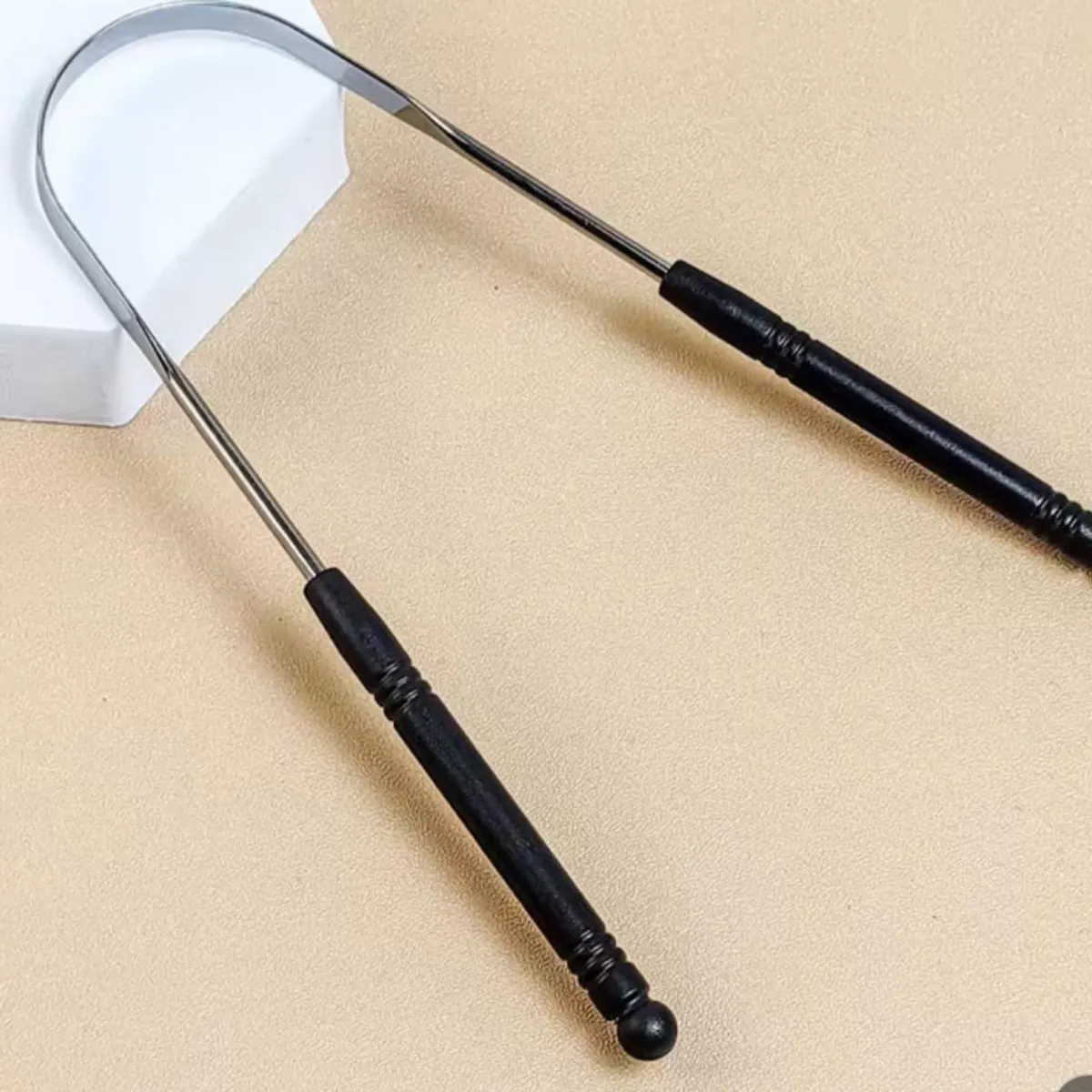Silver And Black Metal Tongue Scraper
