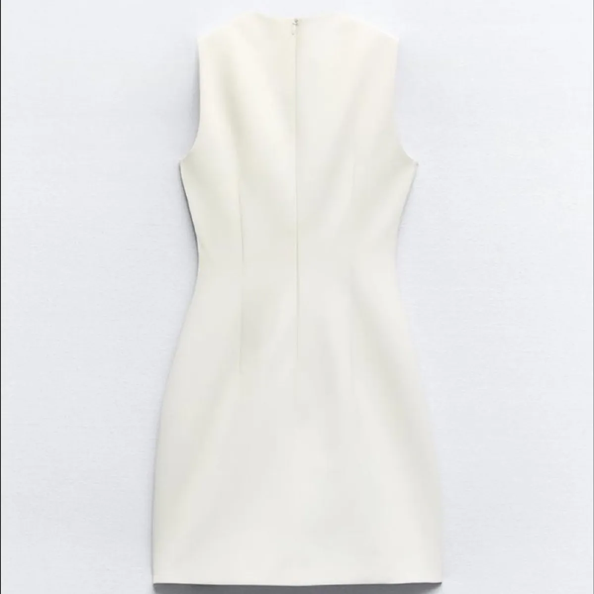 Zara  Cream mini dress featuring a distinctive decorative brown buckle detail on the chest-Size XS