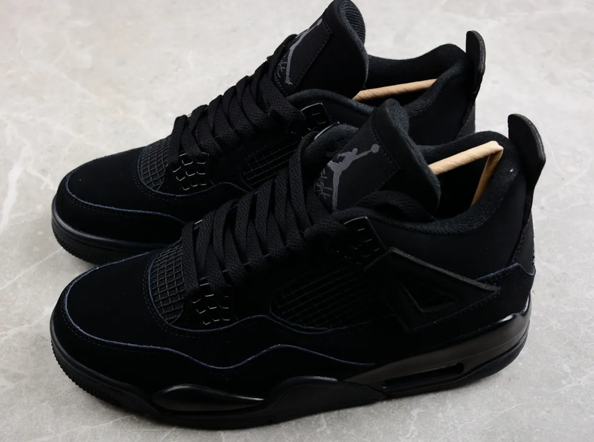 Air Jordan 4 Retro sneakers in the "Black Cat" colorway- Size 8