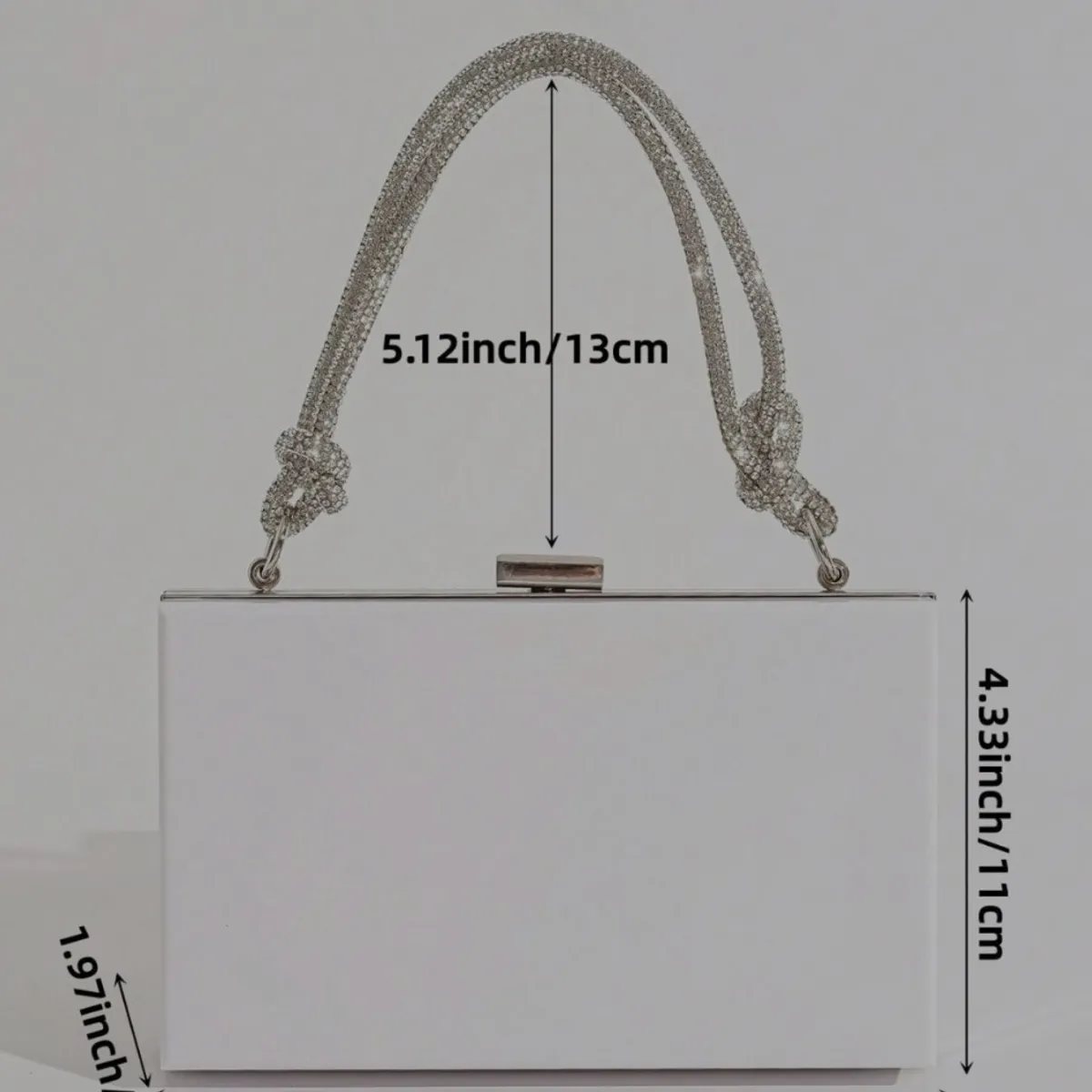 Women's white acrylic clutch features a distinctive rhinestone-encrusted top handle