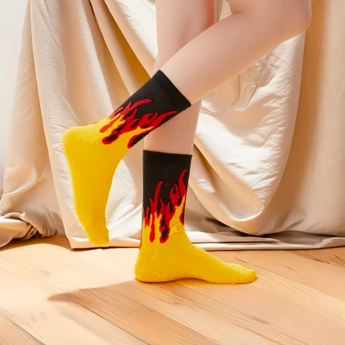 A Pair of Unisex Trendy Yellow Flame Mid-calf Socks